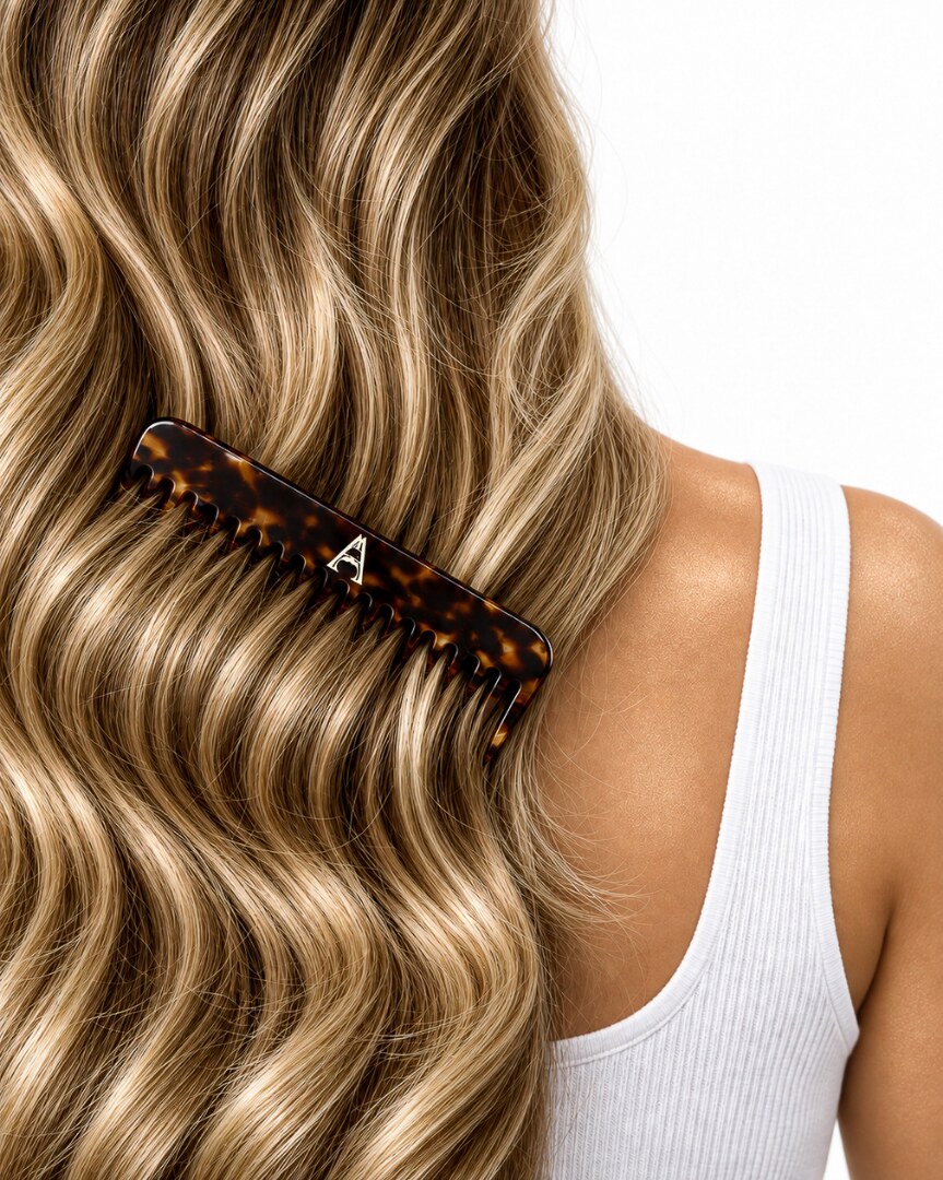Glossy highlighted hair styled with an A Creative Haus tortoiseshell comb